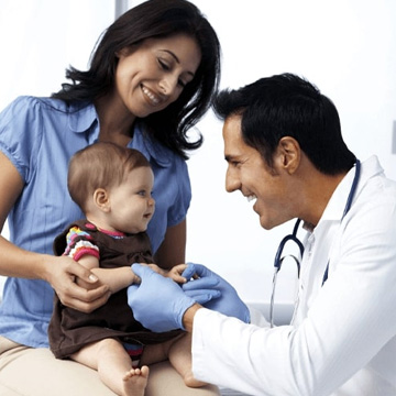 little kid with doctor and mother